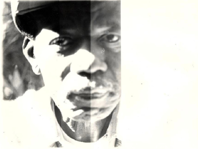 Sepia-toned photograph of man wearing a hat